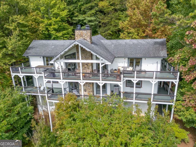 a aerial view of a house with a yard