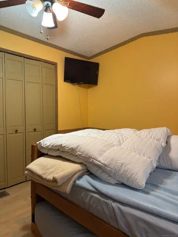 a spacious bedroom with a bed and window