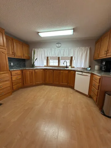 a kitchen with stainless steel appliances cabinets a sink and a stove