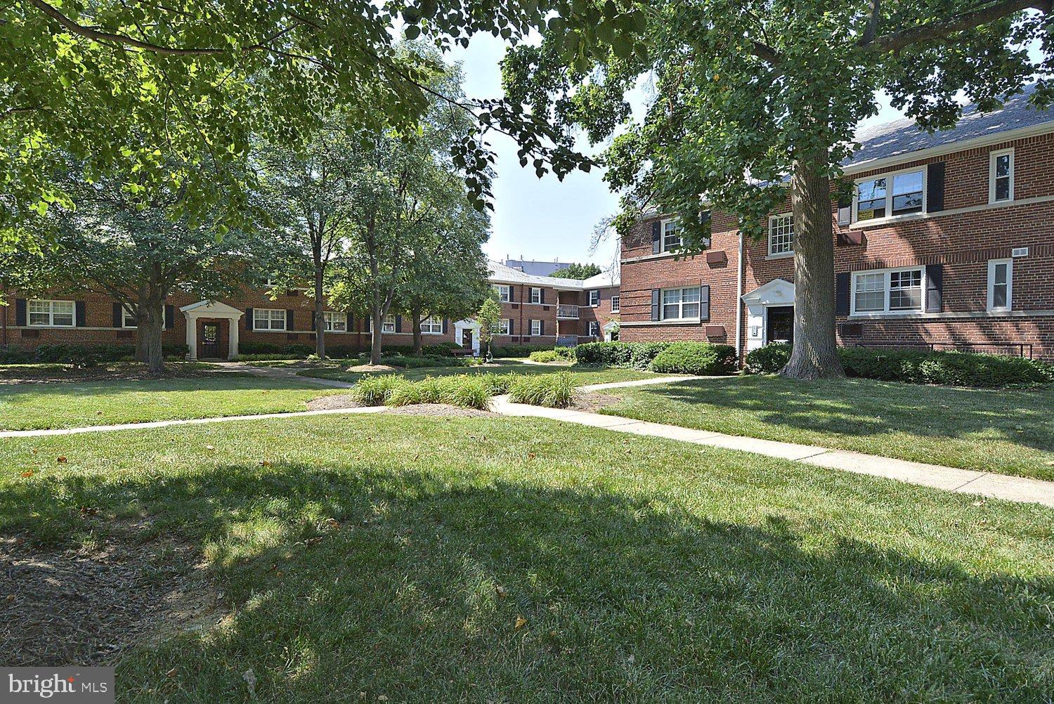 4312 2nd Road North, Unit 2 Arlington, VA 22203 - Photo 32 of 66 Charming brick apartments amid lush greenery.