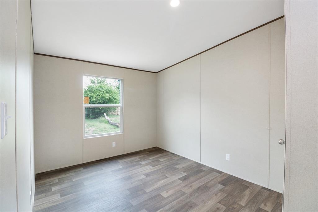 708 West 8th Street Coleman, TX 76834 - Photo 17 of 25 an empty room with a empty space and window