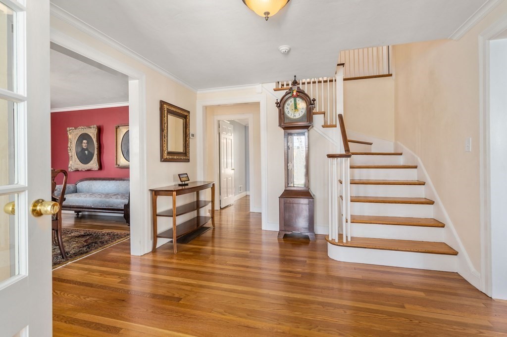 144 Reservoir Road Brookline, MA 02467 - Photo 3 of 21 a view of entryway and hall with wooden floor