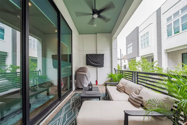 a view of a patio with a table chairs and a potted plant
