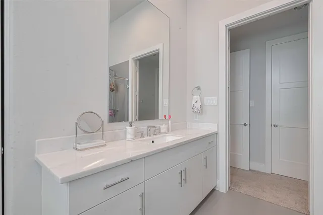 a bathroom with 2 sink and a mirror