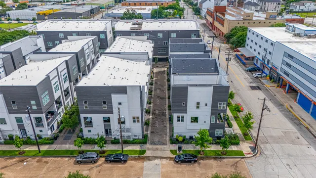 an aerial view of a house with a garden and plants