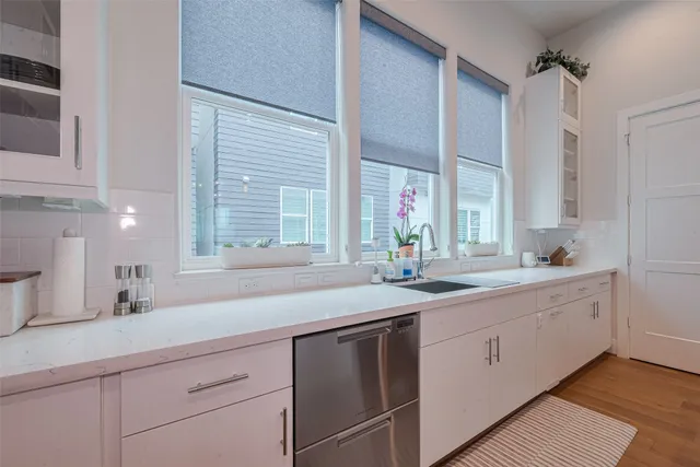 a kitchen with sink and window