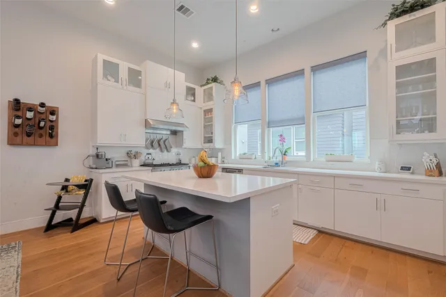 a kitchen with a sink cabinets and window