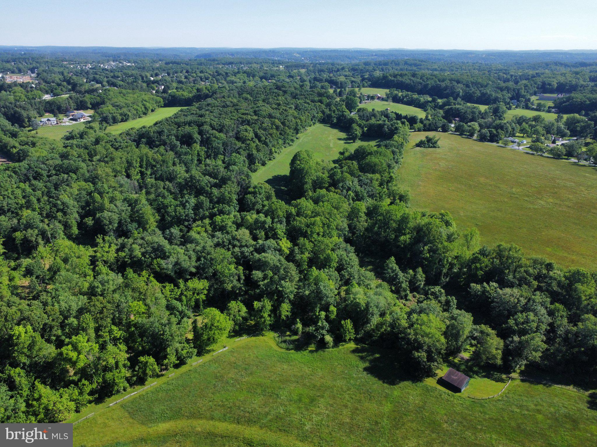 970 Doe Run Road East Fallowfield, PA 19320 - Photo 15 of 16 a view of a green field with lots of bushes