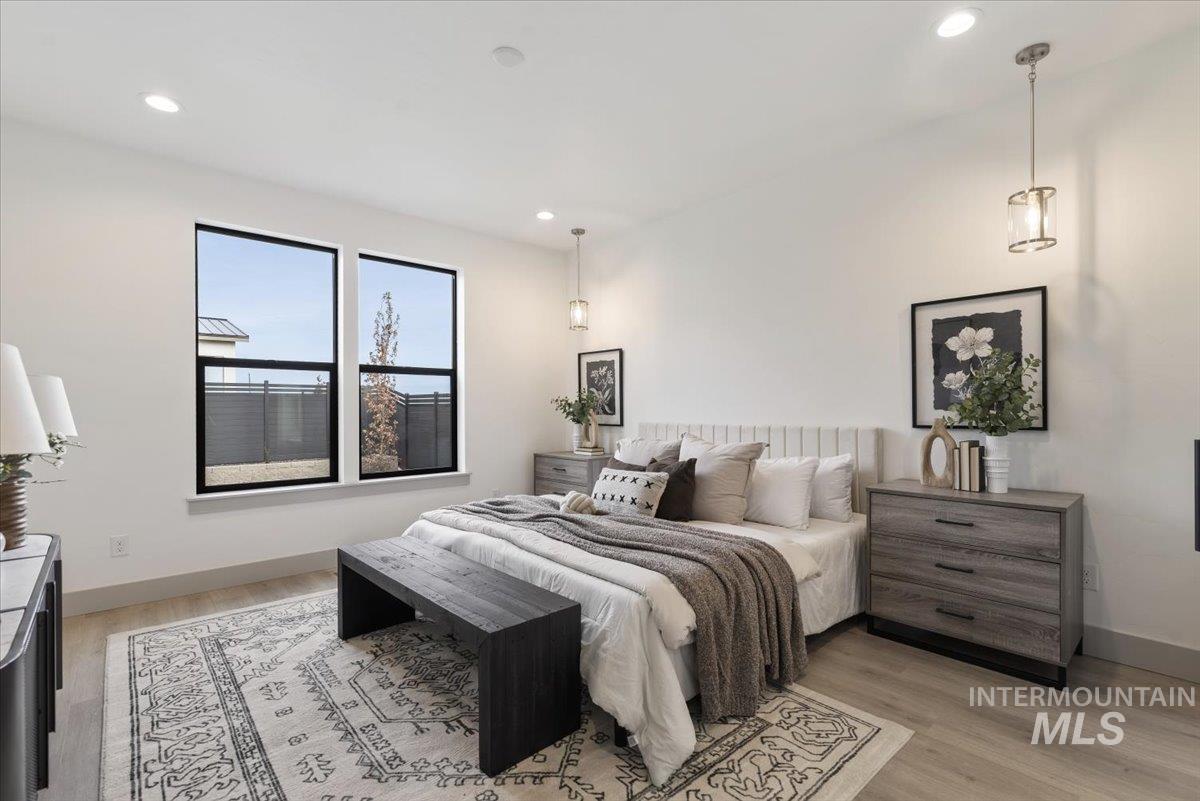 7580 West Old School Street, Unit FREMONT Meridian, ID 83646 - Photo 15 of 28 Bedroom featuring light wood-type flooring and recessed lighting
