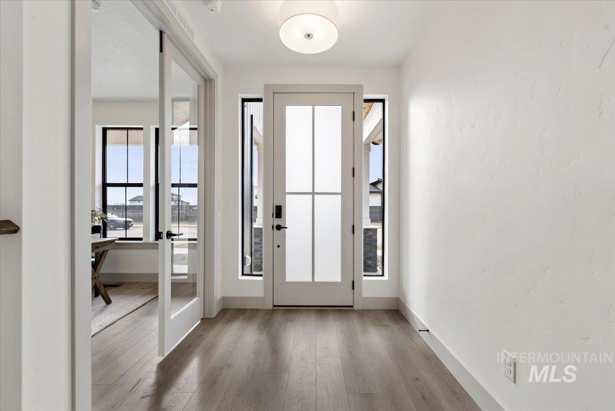 7580 West Old School Street, Unit FREMONT Meridian, ID 83646 - Photo 2 of 28 Foyer entrance with light wood-style flooring and baseboards