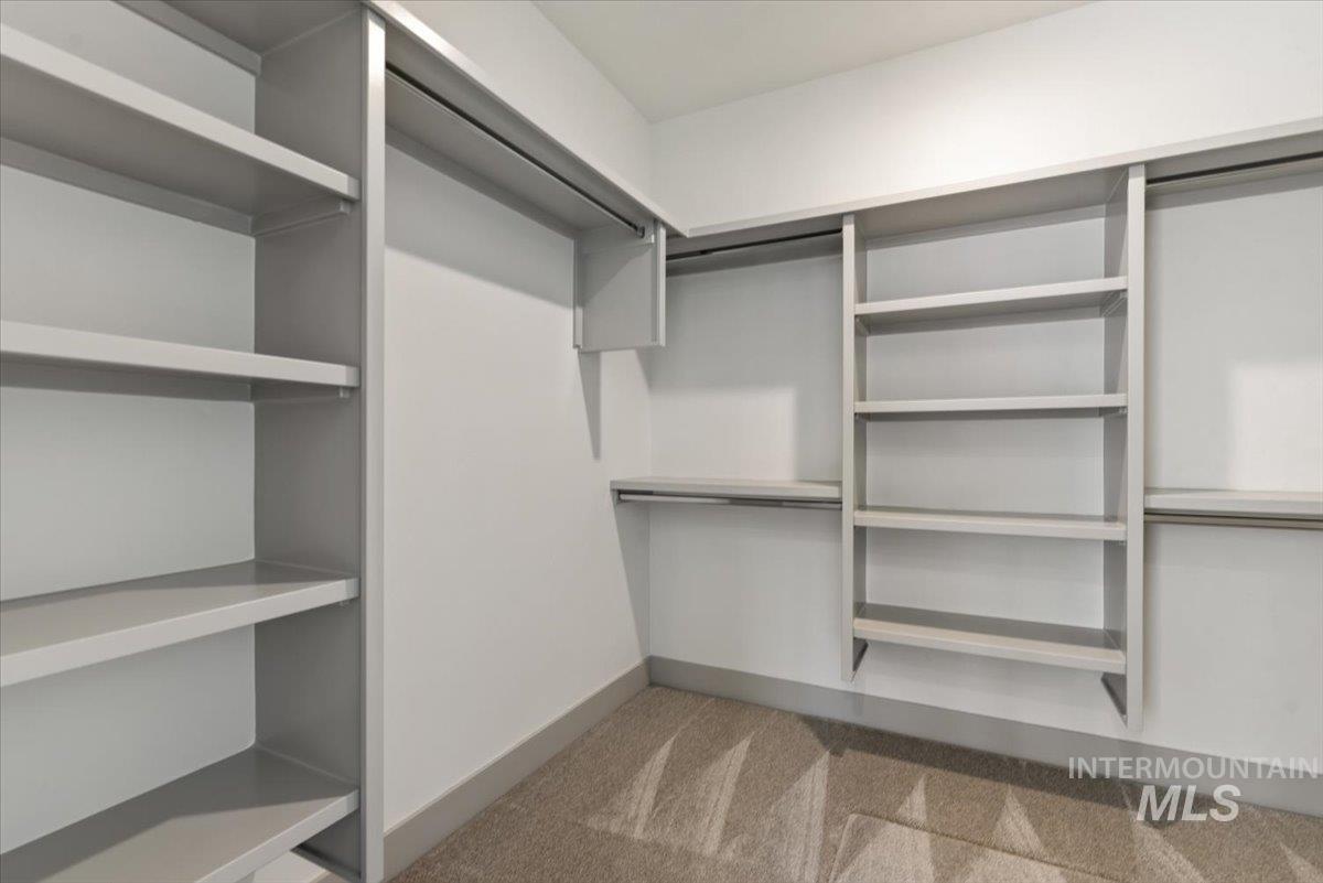 7580 West Old School Street, Unit FREMONT Meridian, ID 83646 - Photo 20 of 28 Walk in closet with light colored carpet