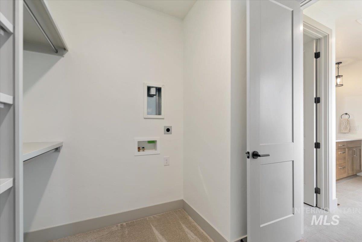 7580 West Old School Street, Unit FREMONT Meridian, ID 83646 - Photo 21 of 28 Laundry room with washer hookup and baseboards
