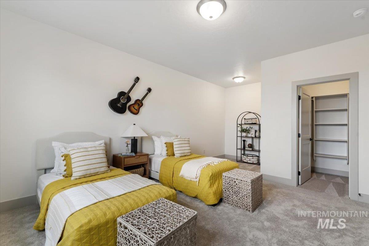 7580 West Old School Street, Unit FREMONT Meridian, ID 83646 - Photo 22 of 28 Bedroom with carpet floors and a spacious closet
