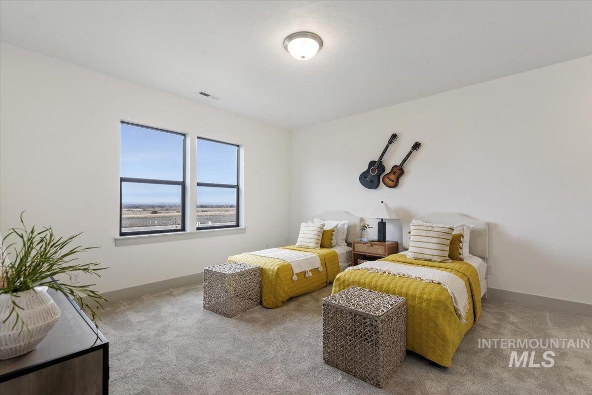 7580 West Old School Street, Unit FREMONT Meridian, ID 83646 - Photo 23 of 28 Carpeted bedroom with baseboards