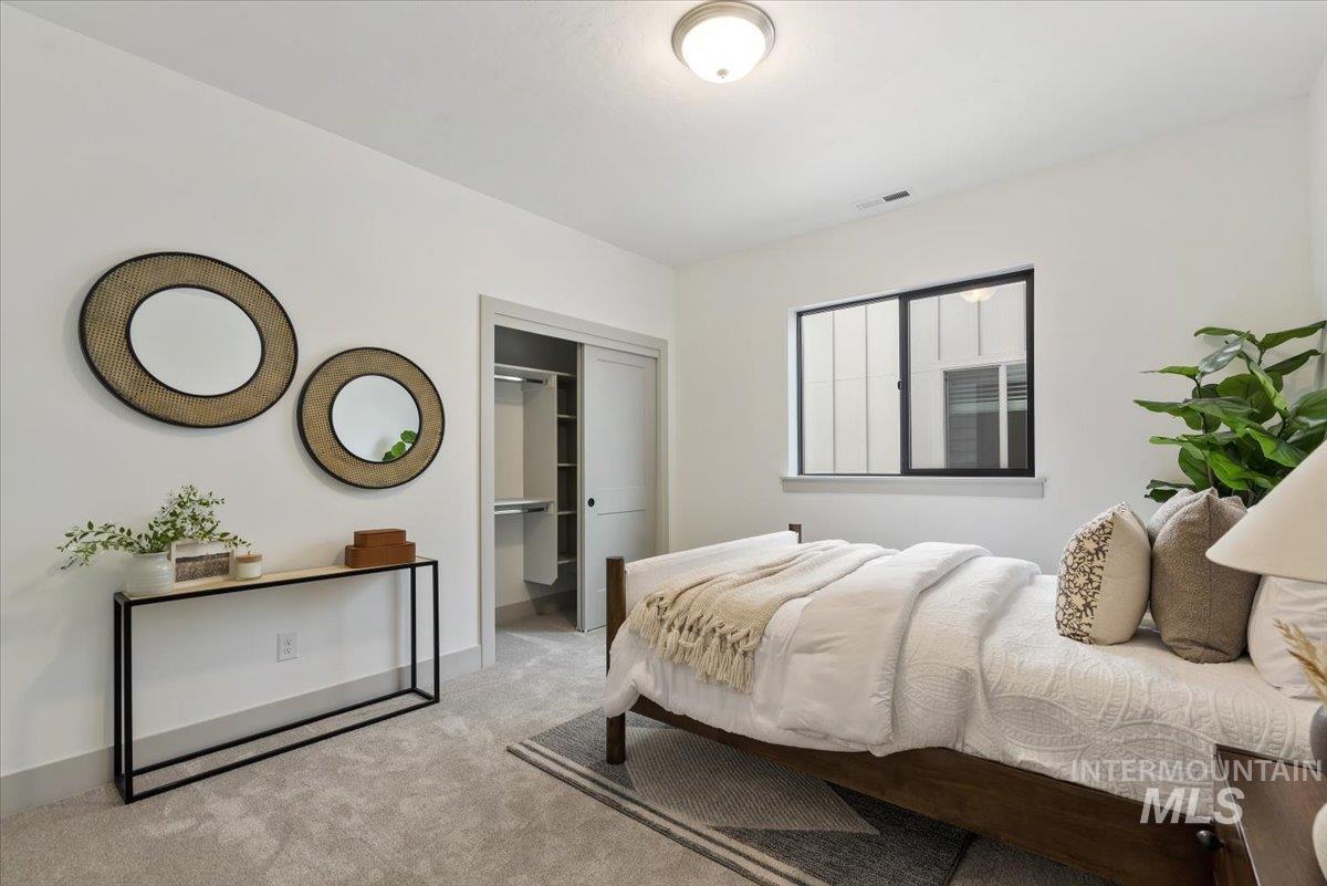 7580 West Old School Street, Unit FREMONT Meridian, ID 83646 - Photo 24 of 28 Carpeted bedroom featuring baseboards