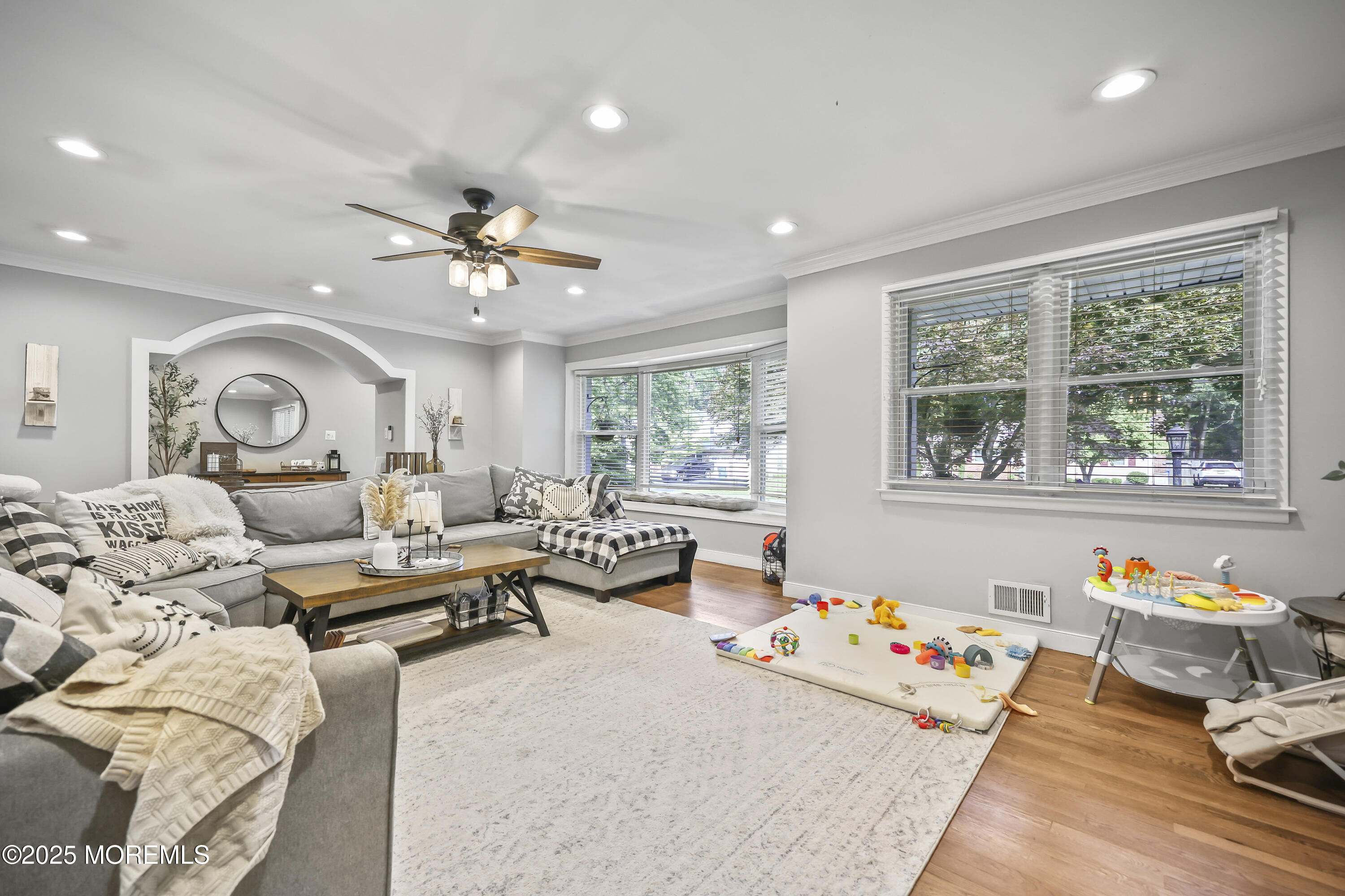 91 Newbury Road Howell, NJ 07731 - Photo 11 of 34 a living room with furniture and a large window