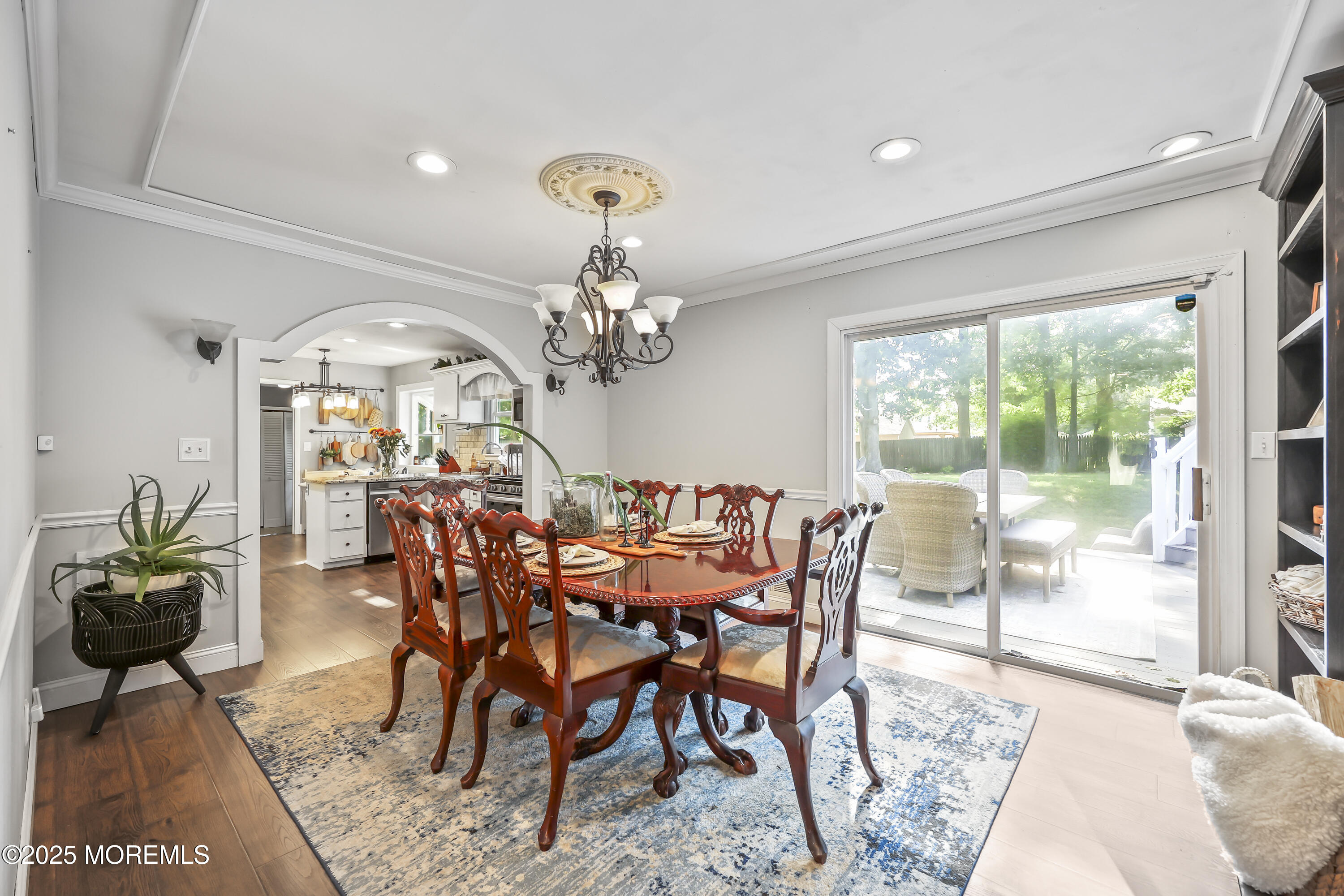 91 Newbury Road Howell, NJ 07731 - Photo 12 of 34 a view of a dining room with furniture a chandelier and wooden floor