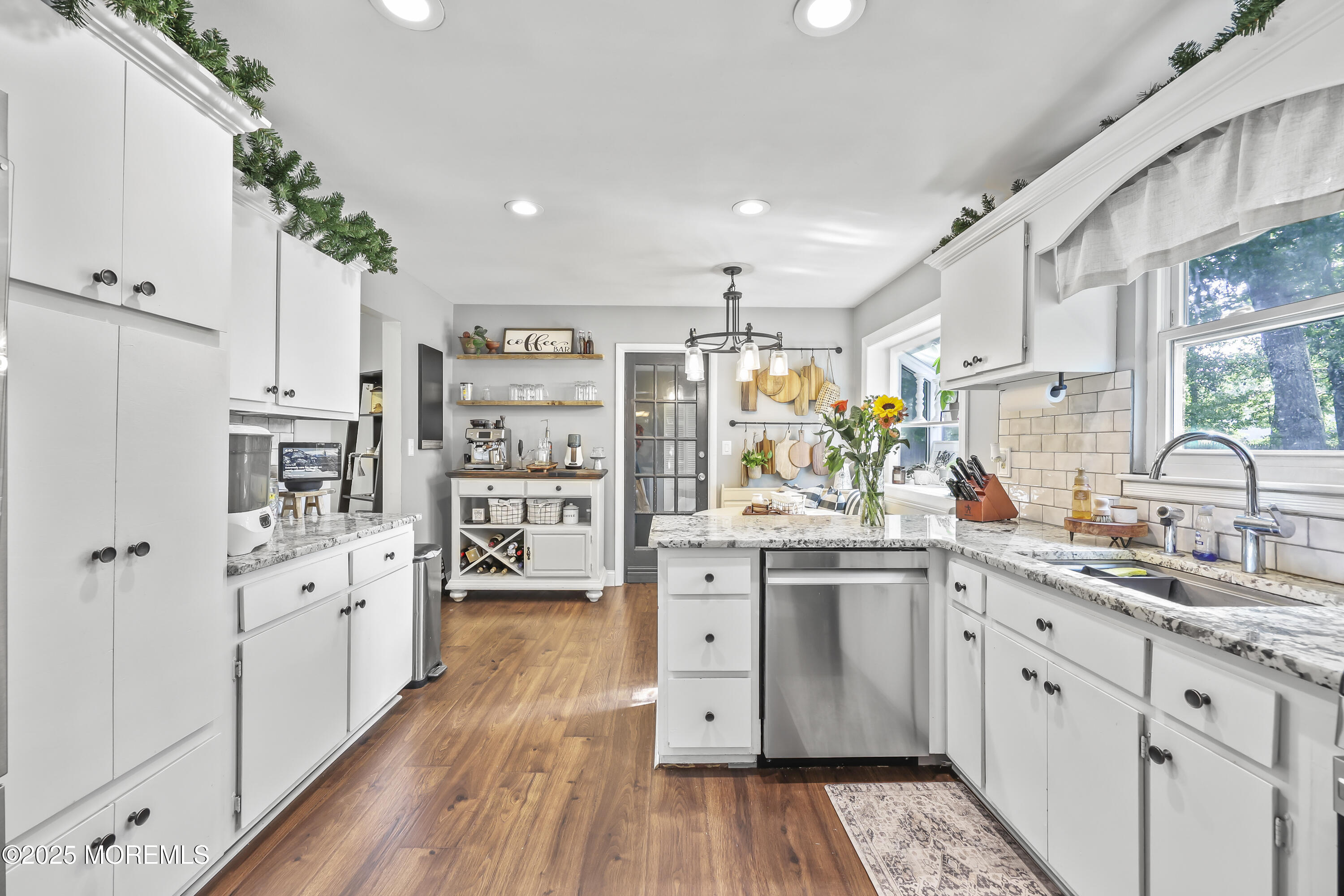 91 Newbury Road Howell, NJ 07731 - Photo 15 of 34 a kitchen with stainless steel appliances a stove top oven and a refrigerator