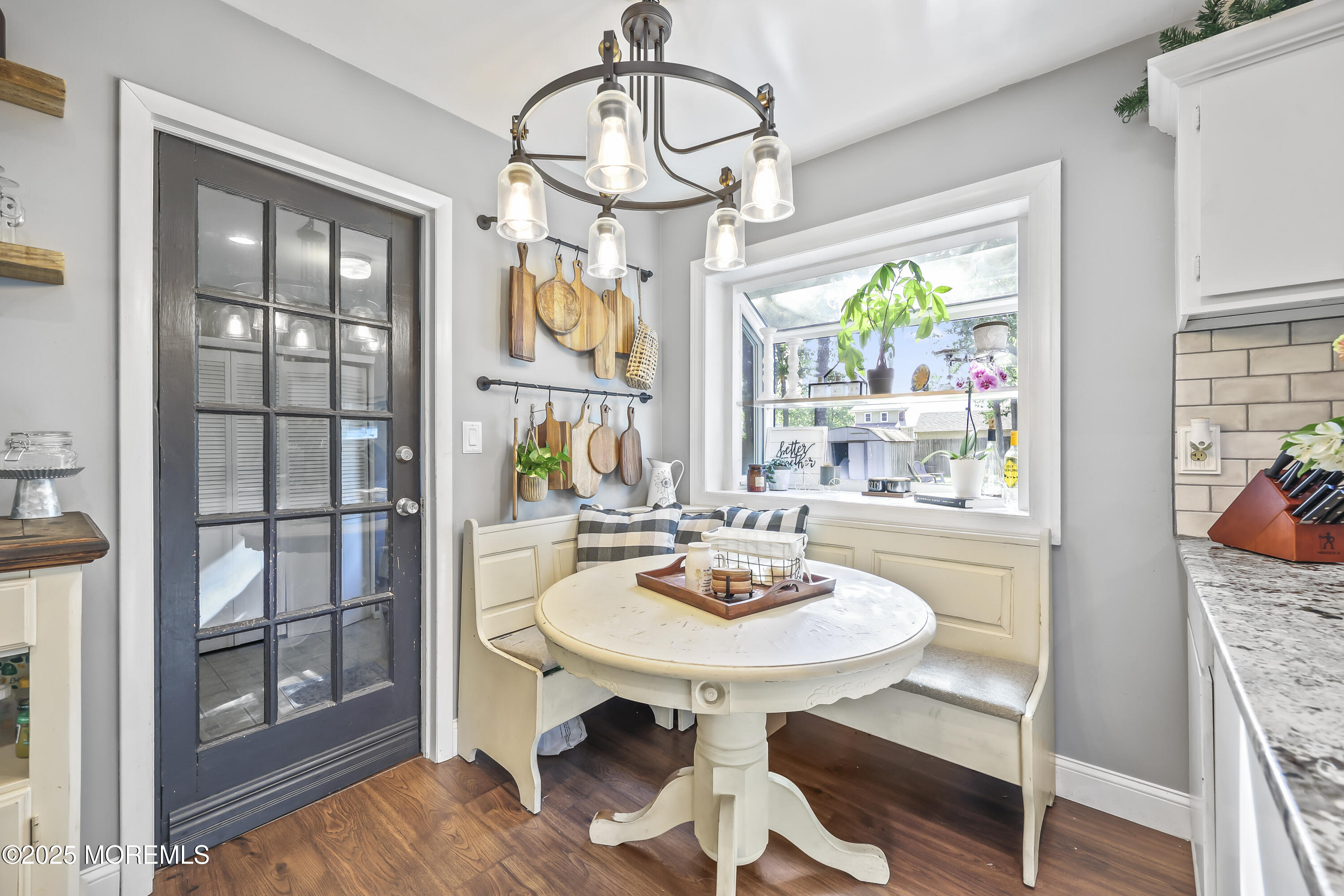 91 Newbury Road Howell, NJ 07731 - Photo 17 of 34 a view of a dining room with furniture a chandelier and wooden floor