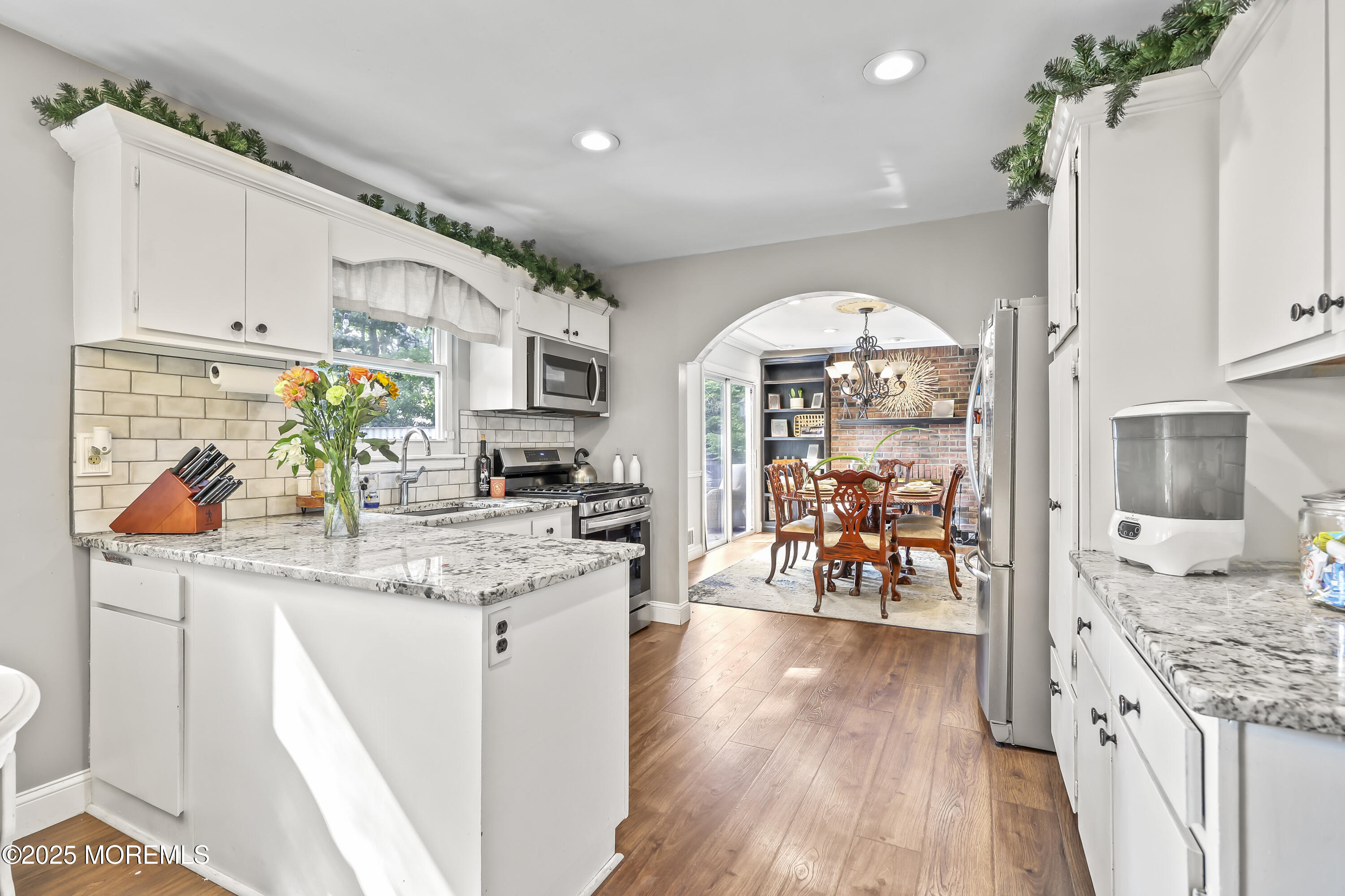 91 Newbury Road Howell, NJ 07731 - Photo 18 of 34 a kitchen with stainless steel appliances granite countertop a stove and cabinets