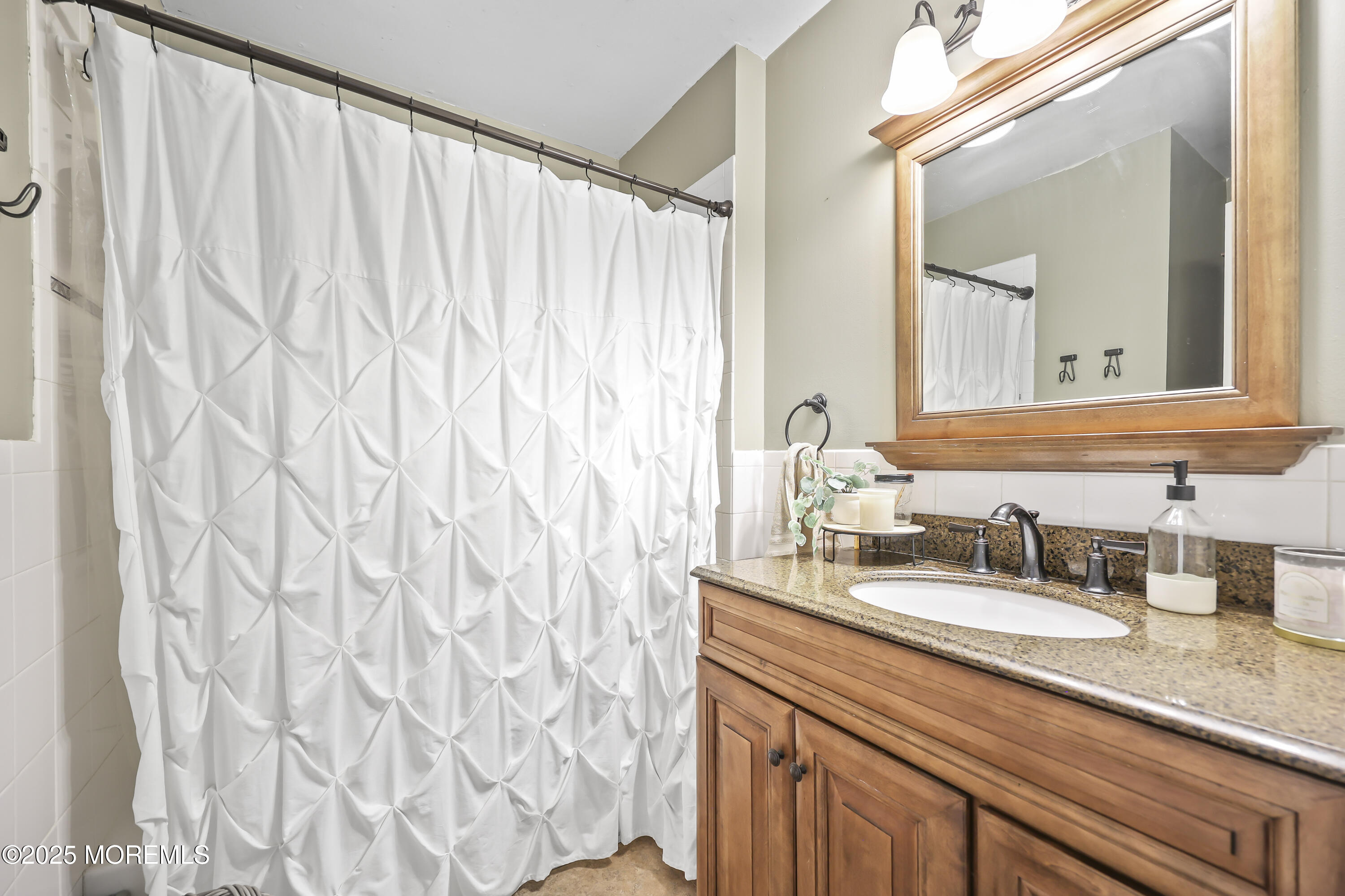 91 Newbury Road Howell, NJ 07731 - Photo 20 of 34 a bathroom with a granite countertop sink and a mirror
