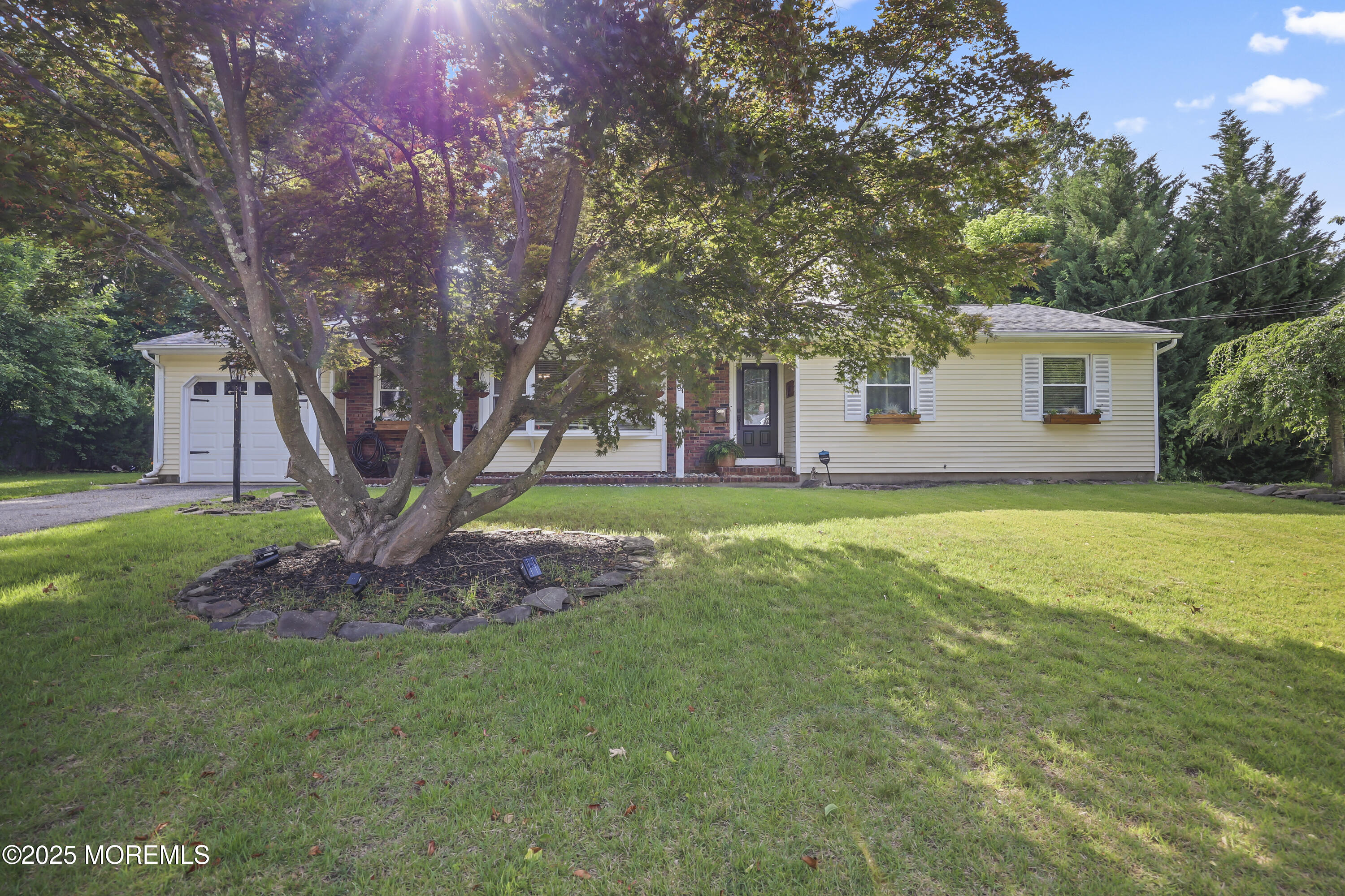 91 Newbury Road Howell, NJ 07731 - Photo 2 of 34 a front view of house with yard and green space