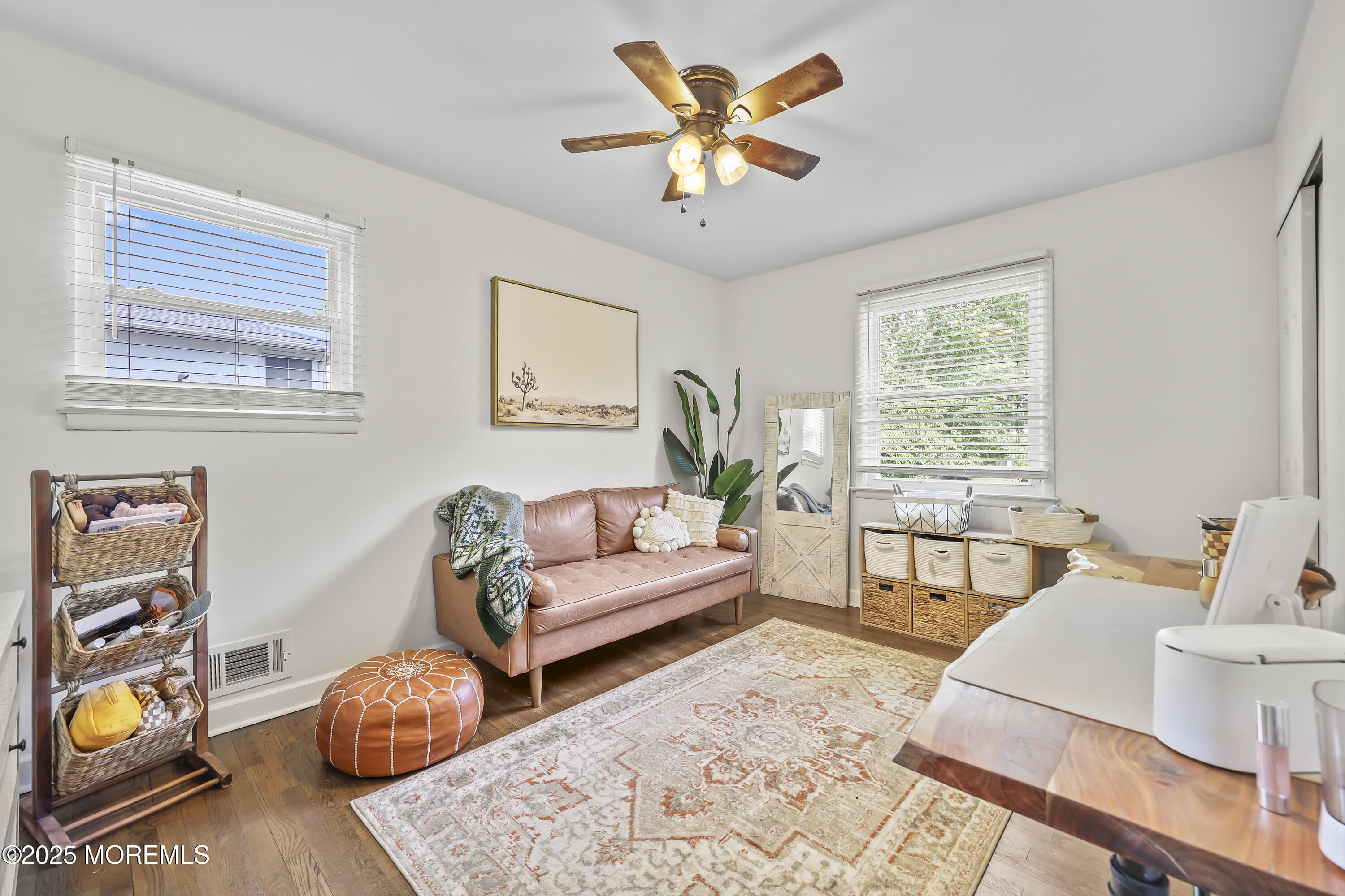 91 Newbury Road Howell, NJ 07731 - Photo 22 of 34 a living room with furniture and wooden floor