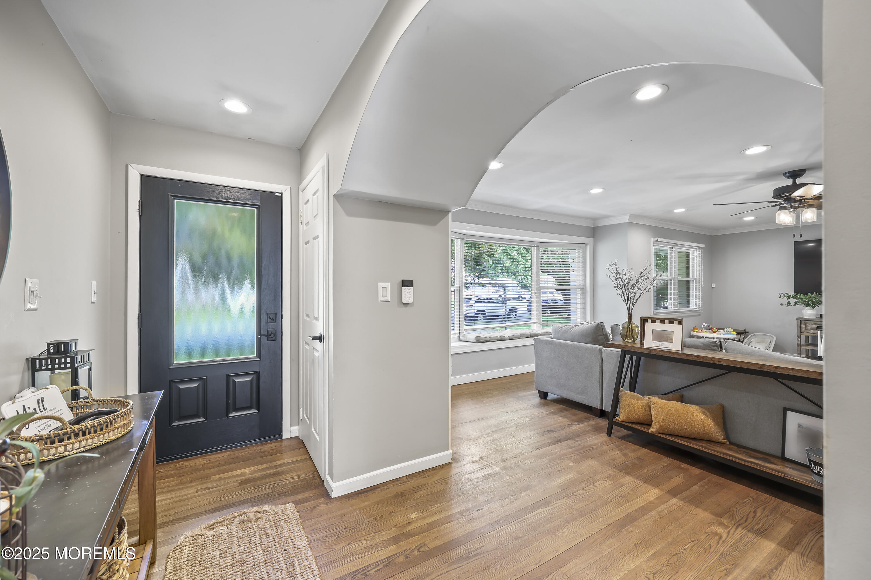 91 Newbury Road Howell, NJ 07731 - Photo 6 of 34 a living room with stainless steel appliances granite countertop furniture wooden floor and a kitchen view