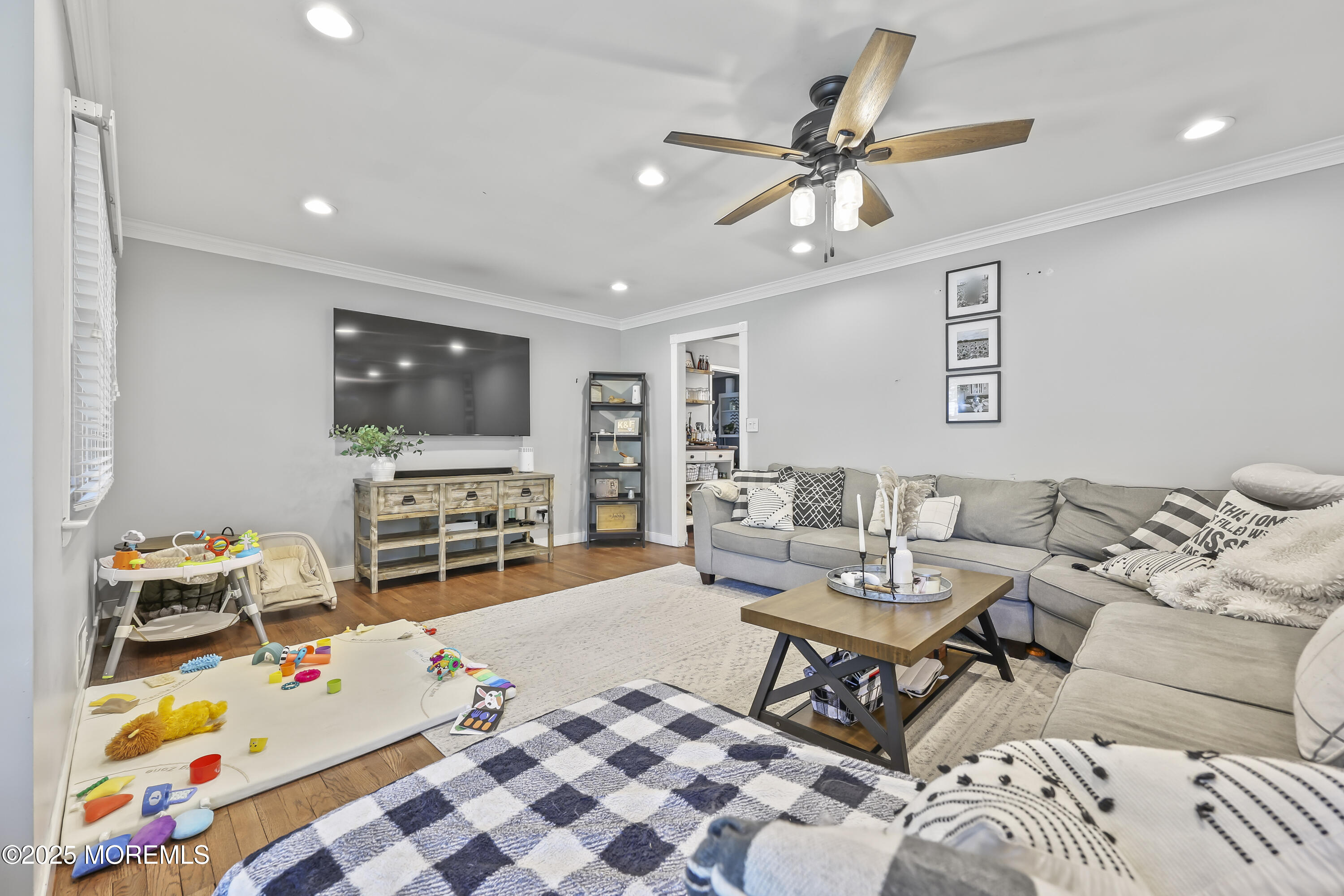 91 Newbury Road Howell, NJ 07731 - Photo 9 of 34 a living room with furniture and a flat screen tv