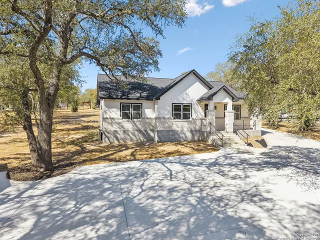 a view of a house with snow on the tree