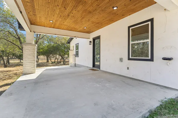 a view of a room with a large window