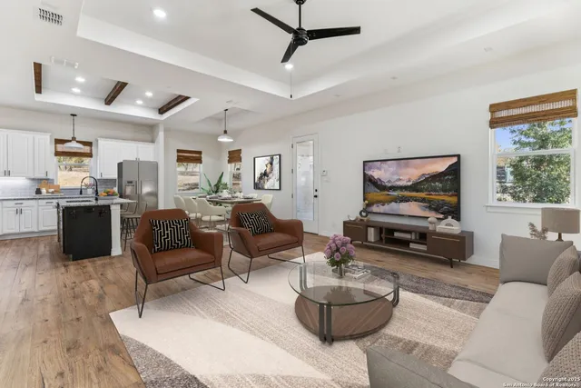 a living room with furniture and a flat screen tv