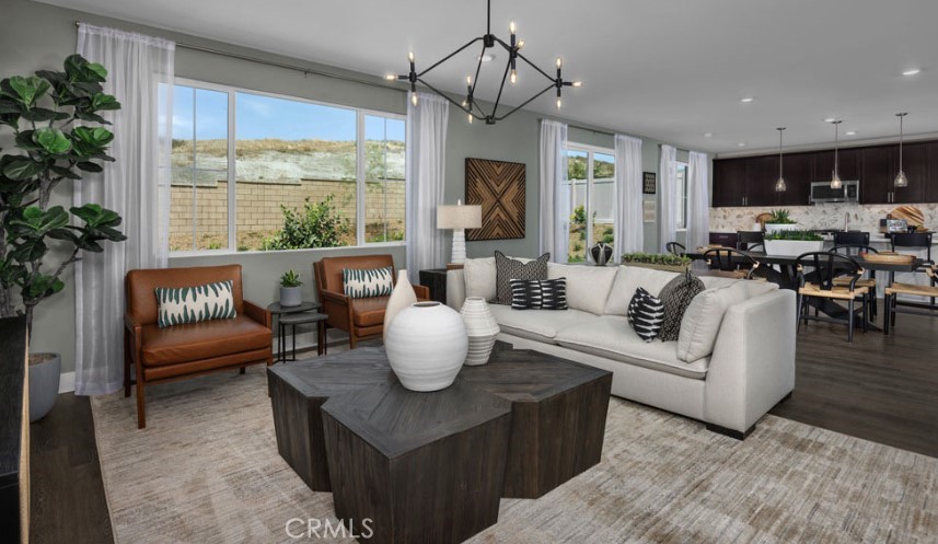 33425 Rusty Court French Valley, CA 92596 - Photo 7 of 25 a living room with furniture a window and a chandelier
