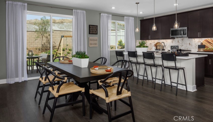 33425 Rusty Court French Valley, CA 92596 - Photo 8 of 25 a view of a dining room with furniture and wooden floor