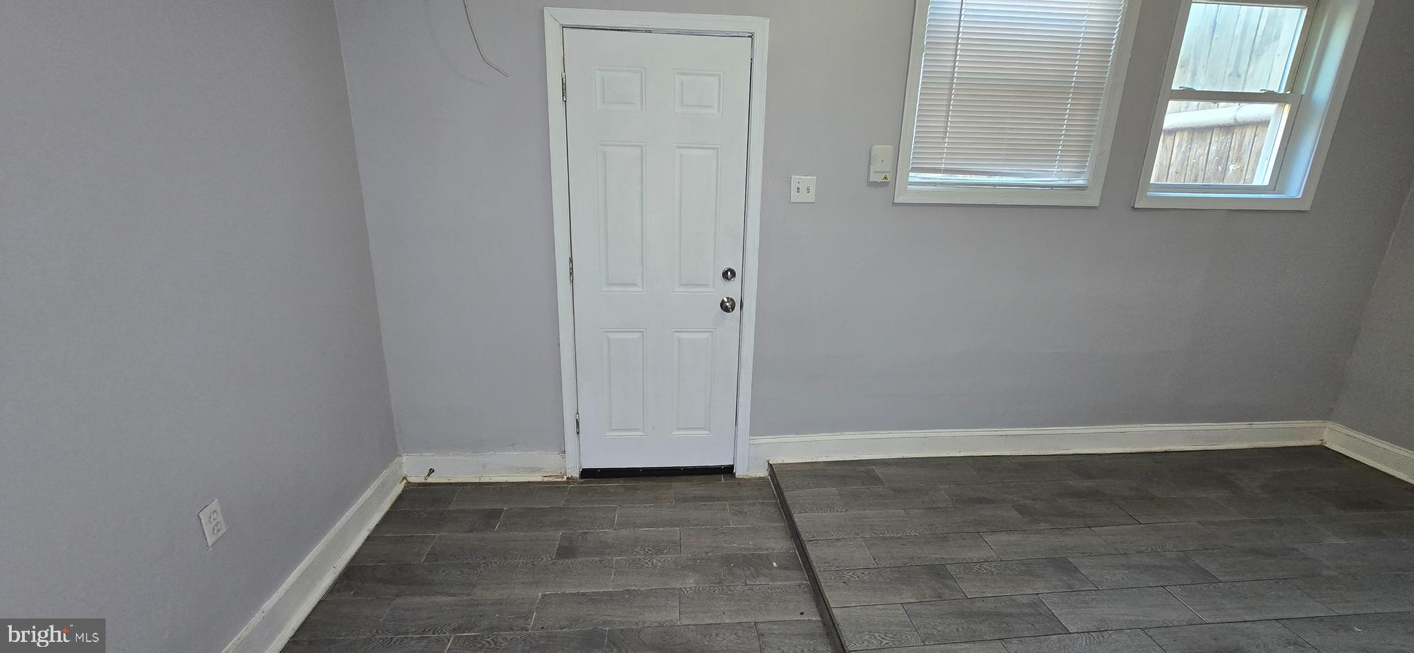 1702 Gales Street Northeast, Unit 3 Washington, DC 20002 - Photo 11 of 13 an empty room with wooden floor and windows
