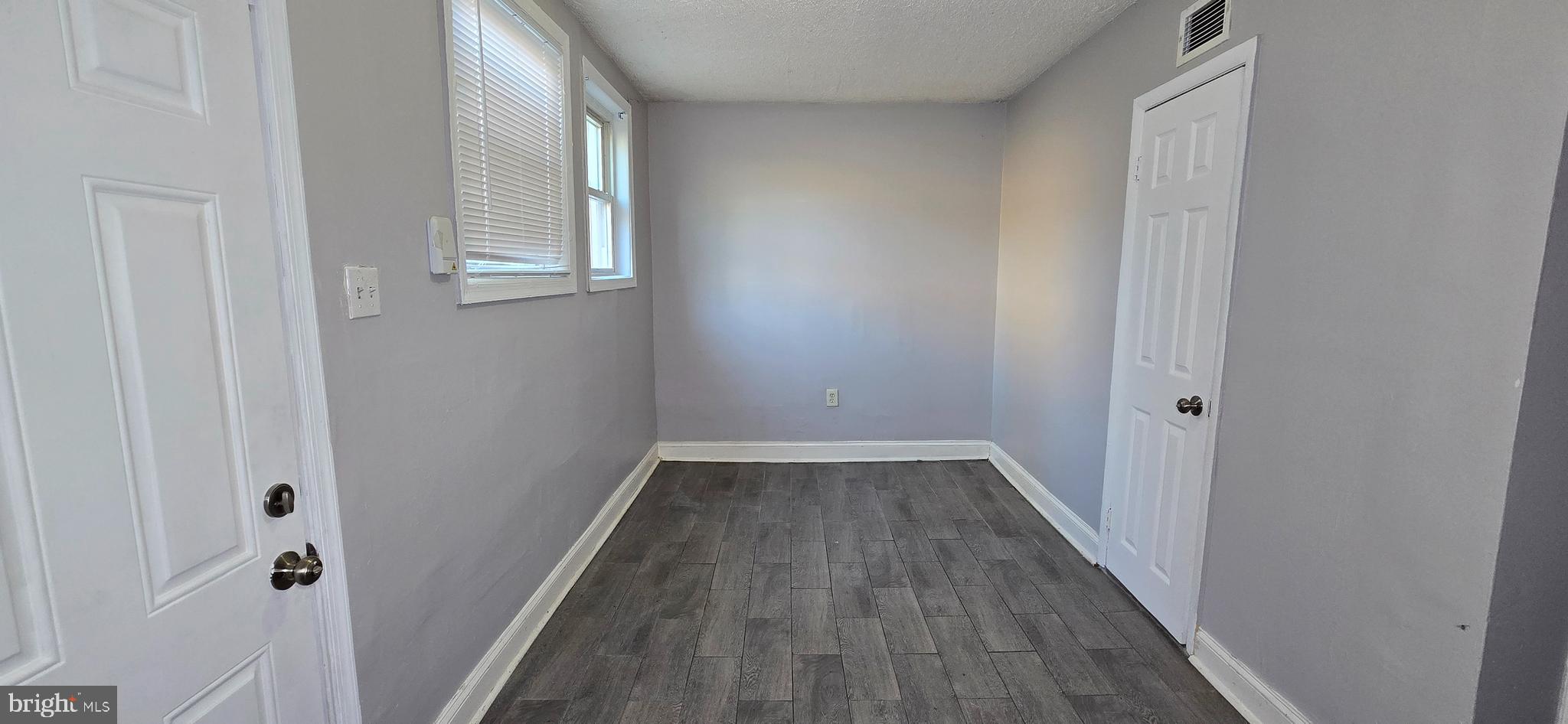 1702 Gales Street Northeast, Unit 3 Washington, DC 20002 - Photo 12 of 13 a view of a hallway with wooden floor