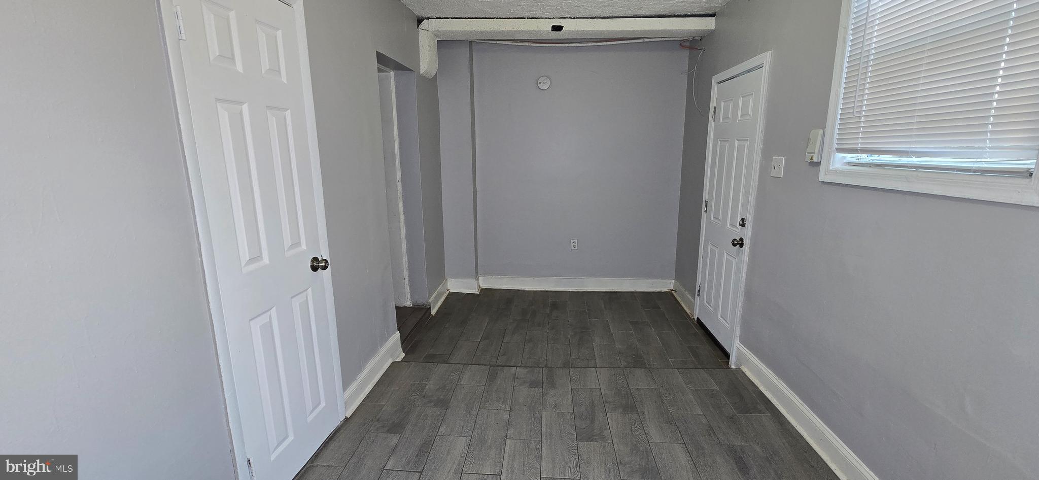 1702 Gales Street Northeast, Unit 3 Washington, DC 20002 - Photo 13 of 13 a view of a hallway with wooden floor