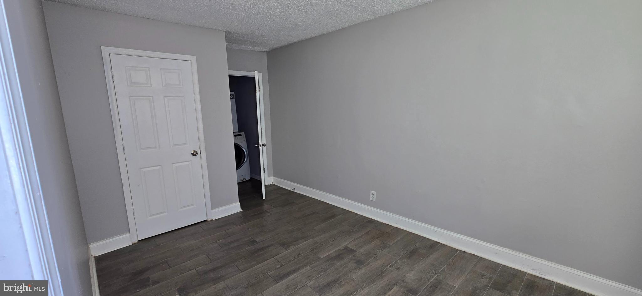 1702 Gales Street Northeast, Unit 3 Washington, DC 20002 - Photo 3 of 13 a view of an empty room with wooden floor