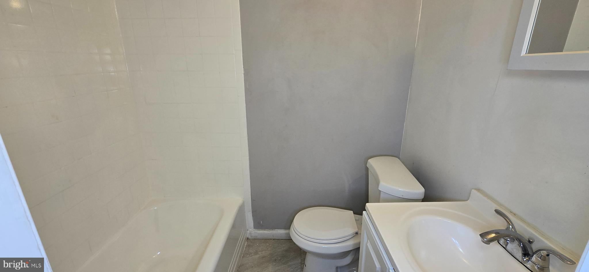 1702 Gales Street Northeast, Unit 3 Washington, DC 20002 - Photo 5 of 13 a white toilet sitting next to a white wall
