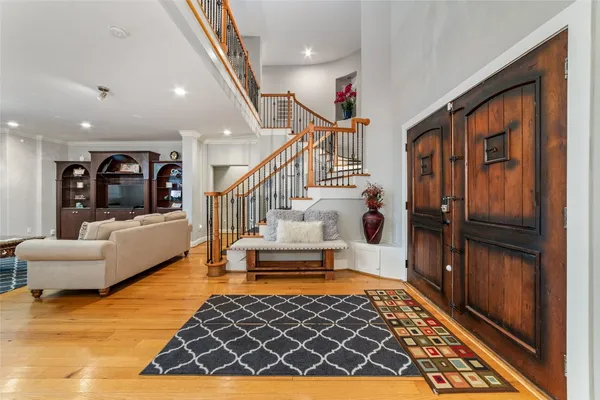 a living room with fireplace furniture and a wooden floor