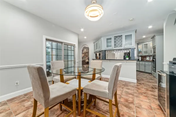 a kitchen with stainless steel appliances granite countertop a stove and cabinets