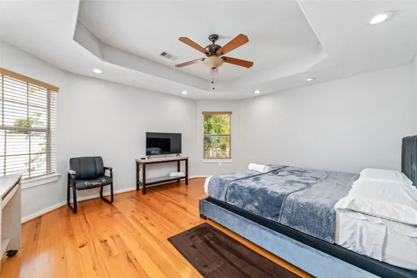 a bedroom with a bed furniture and a window