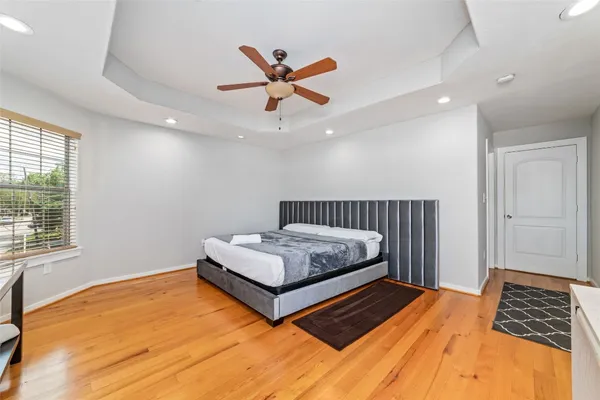 a bedroom with a bed and window