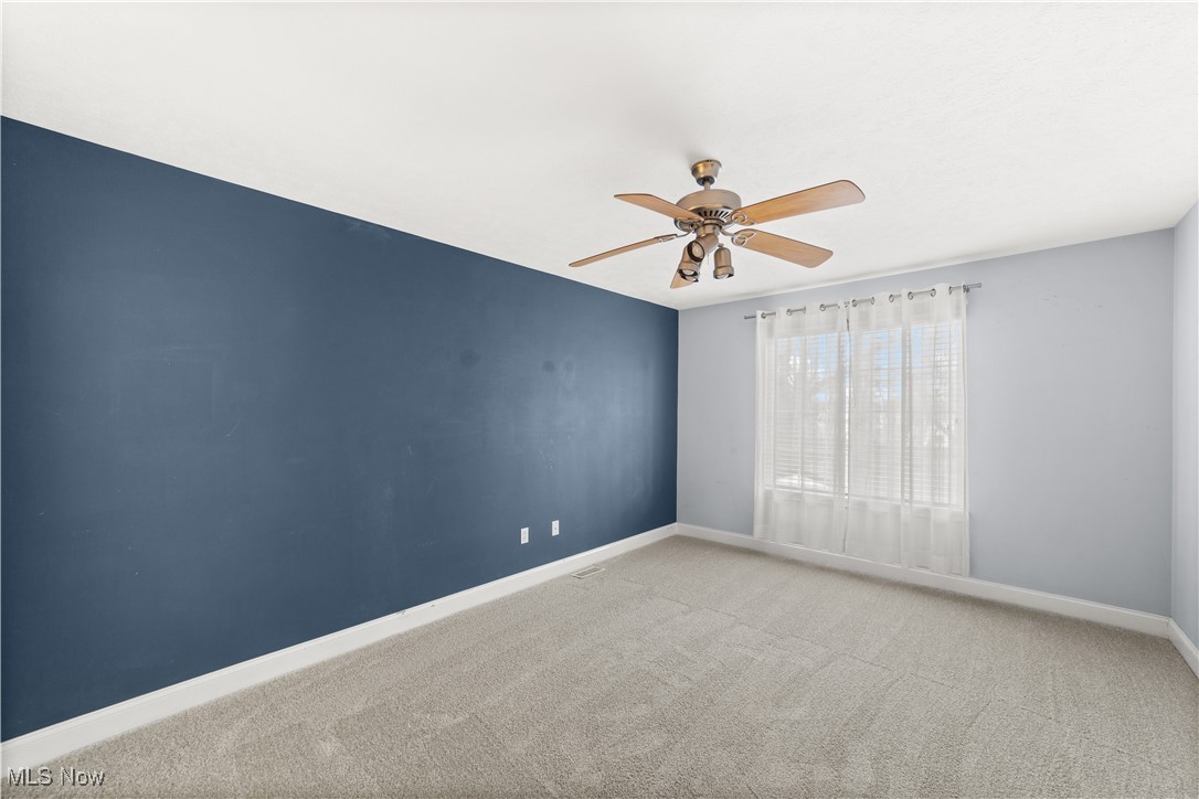 1802 Spring Road Cleveland, OH 44109 - Photo 25 of 40 Spare room featuring carpet flooring and ceiling fan