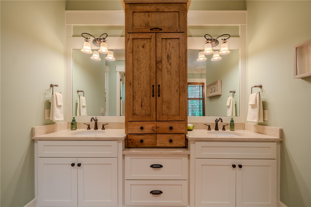 102 State Rd S-39-143 Sunset, SC 29685 - Photo 29 of 47 This primary bathroom features double vanities, sleek fixtures, and ample storage.