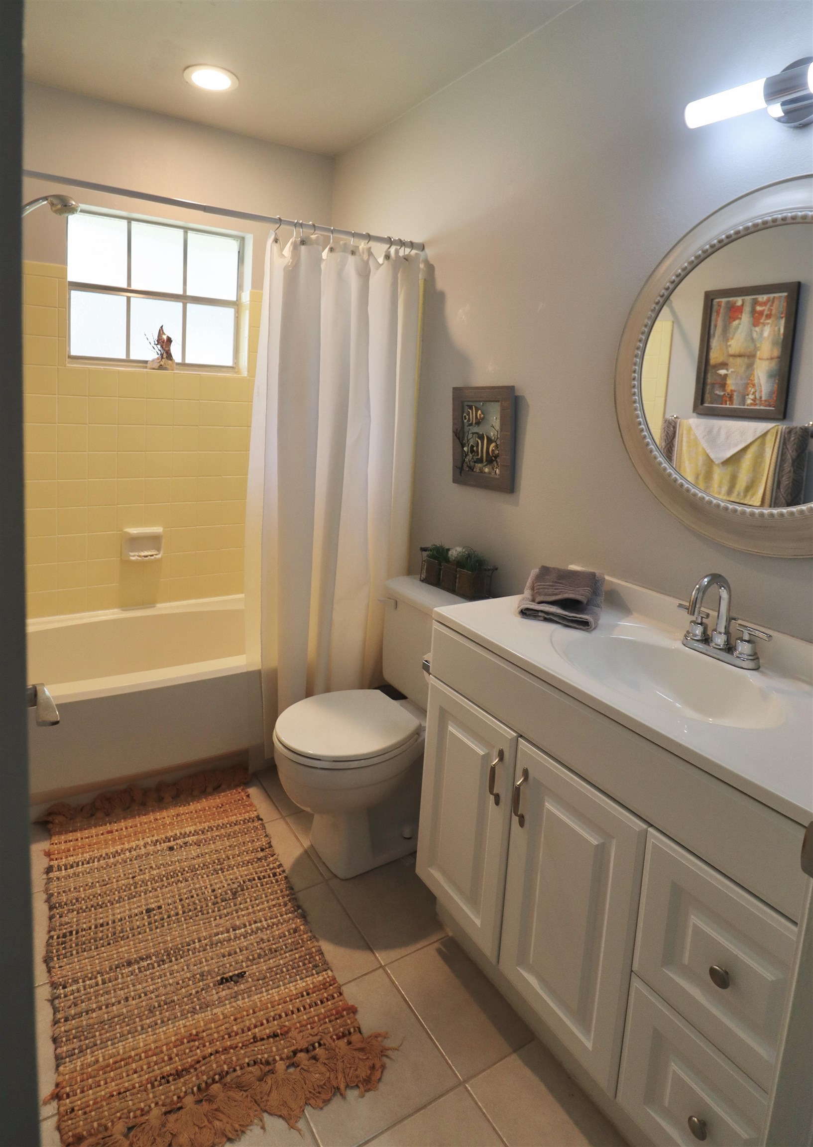 1017 San Remo Road St. Augustine, FL 32086 - Photo 15 of 23 a spacious bathroom with a toilet sink and mirror