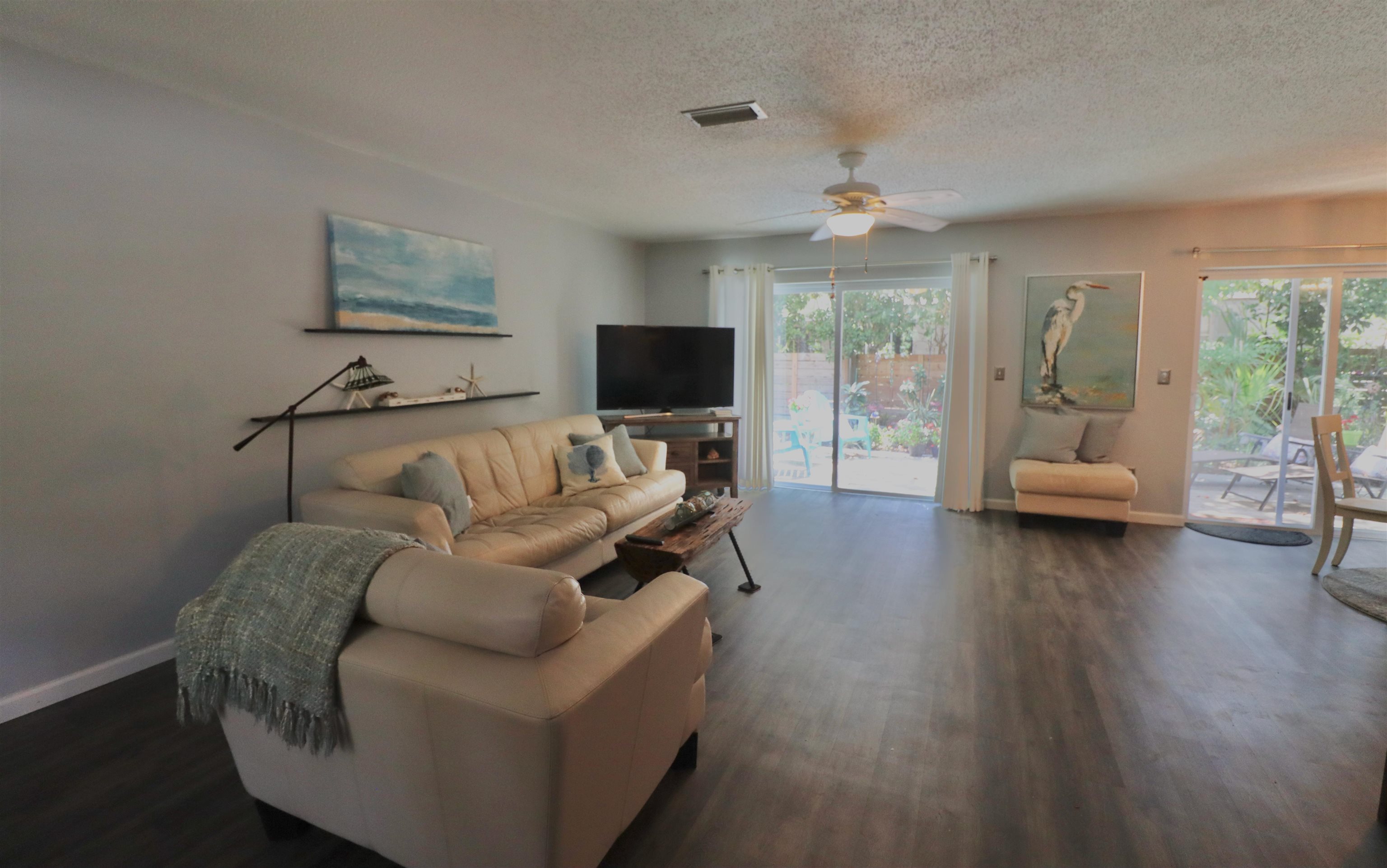 1017 San Remo Road St. Augustine, FL 32086 - Photo 3 of 23 a living room with furniture and a flat screen tv