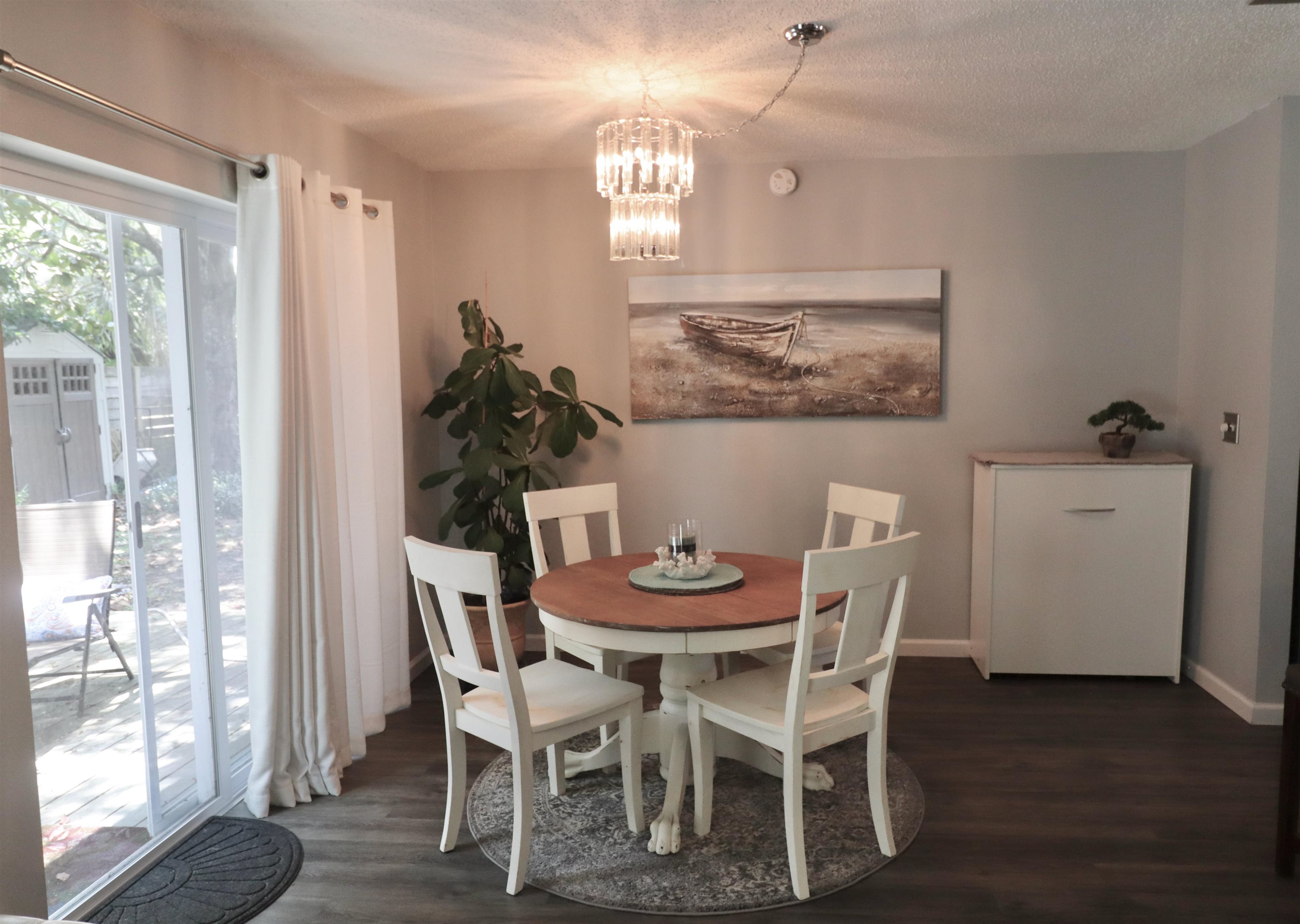 1017 San Remo Road St. Augustine, FL 32086 - Photo 6 of 23 a view of a dining room with furniture and wooden floor