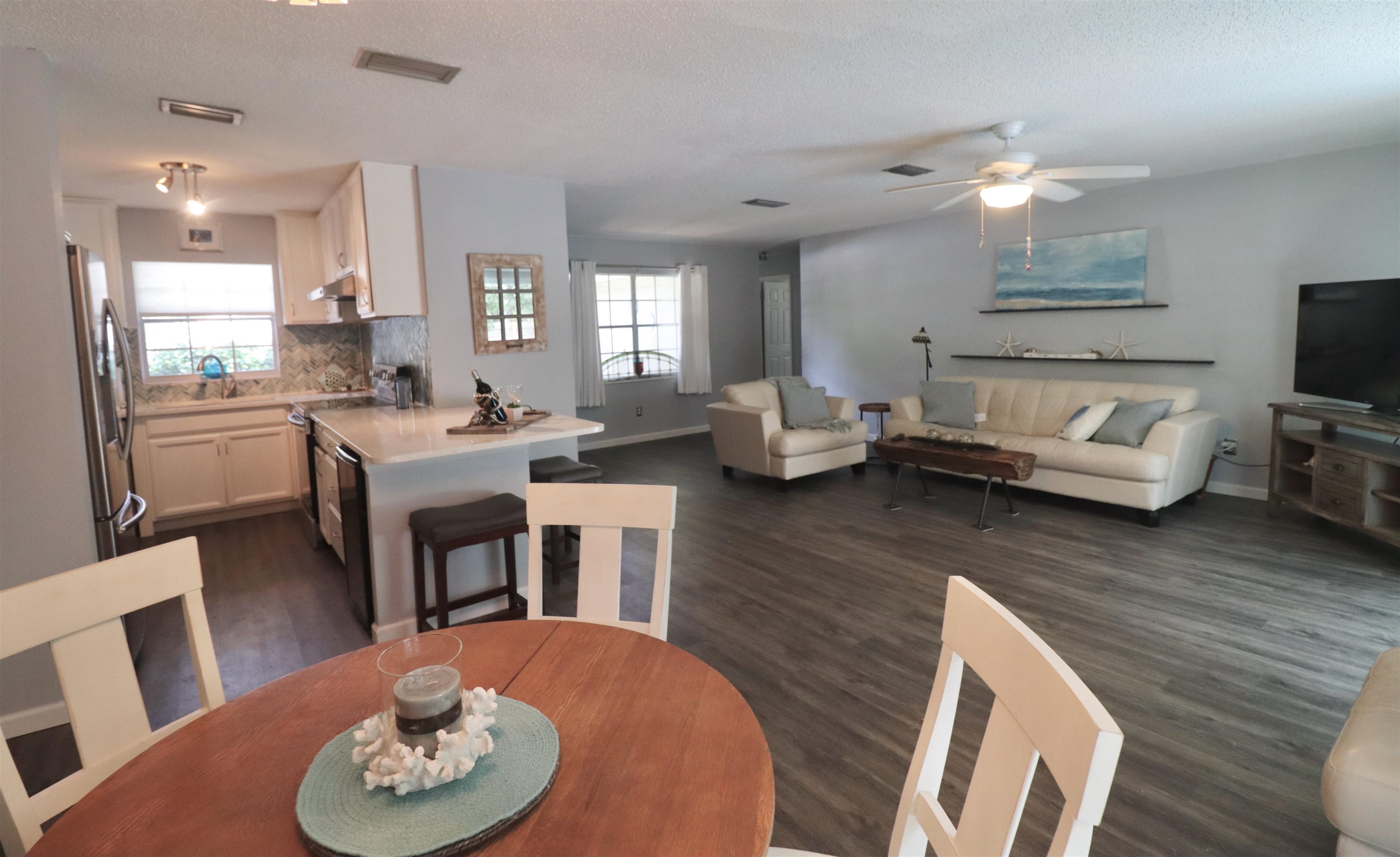 1017 San Remo Road St. Augustine, FL 32086 - Photo 8 of 23 a living room with furniture and a wooden floor