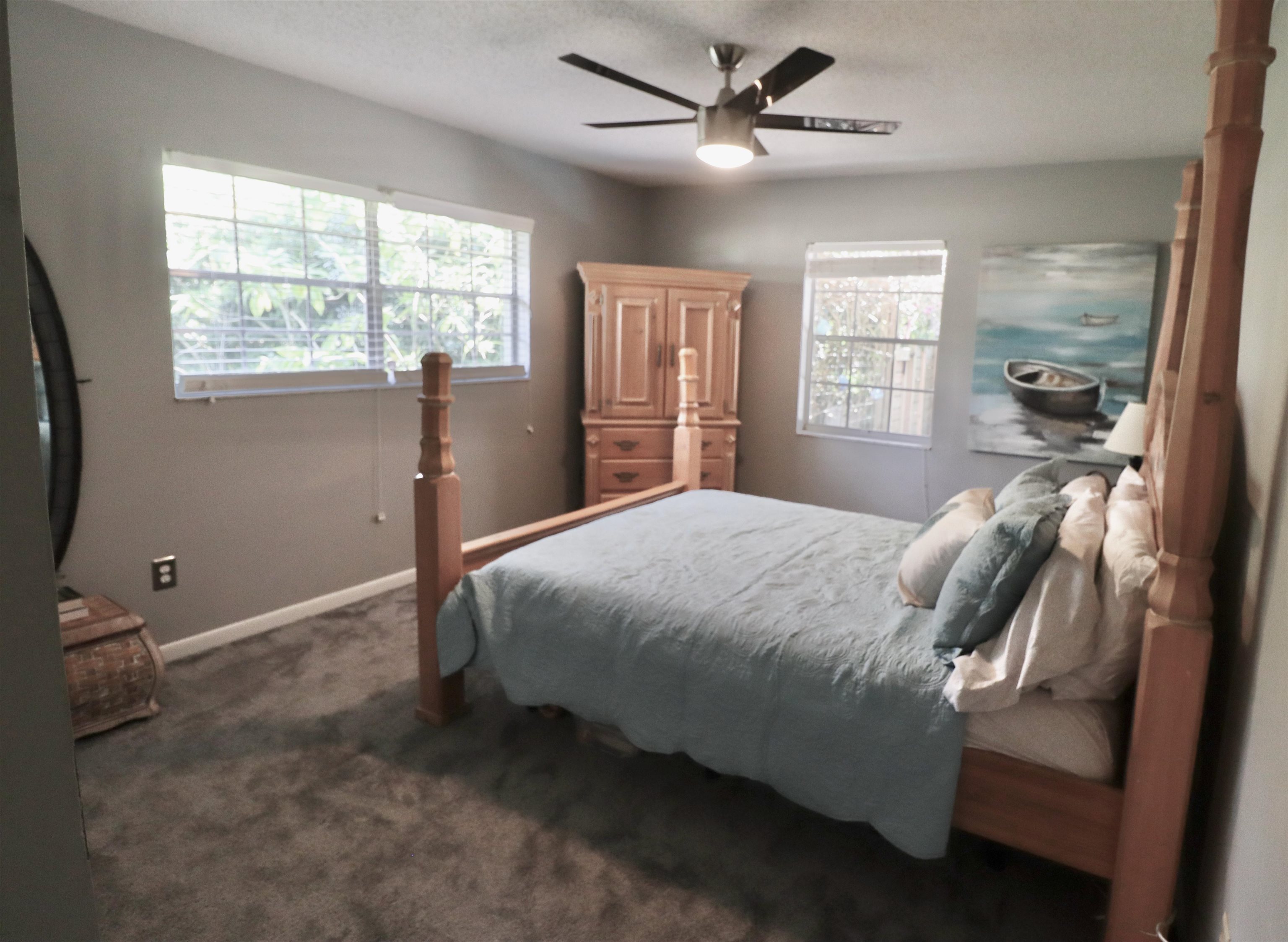 1017 San Remo Road St. Augustine, FL 32086 - Photo 10 of 23 a bedroom with a bed and a large window